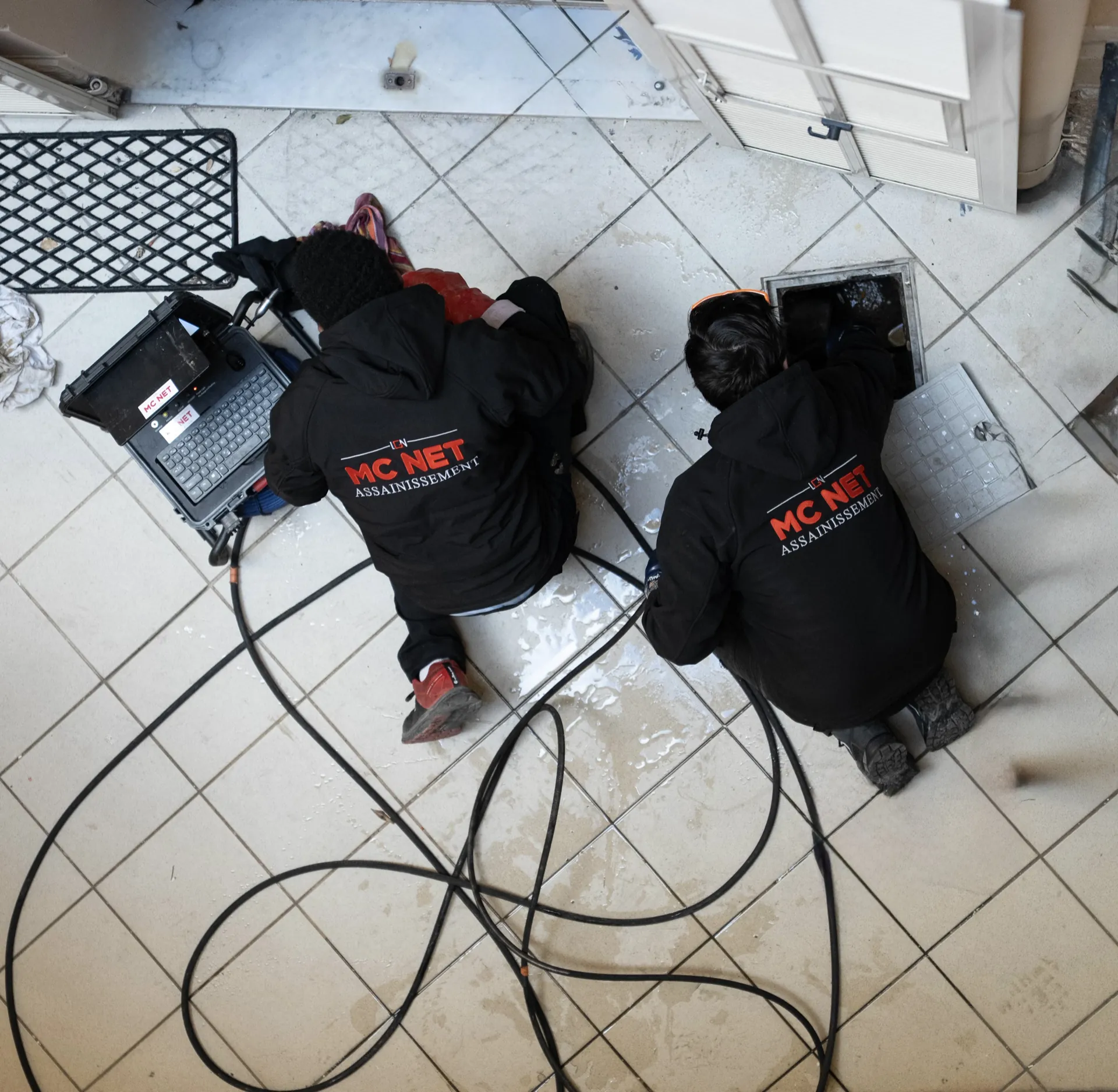 MC NET Sanitation technicians performing CCTV drain inspection