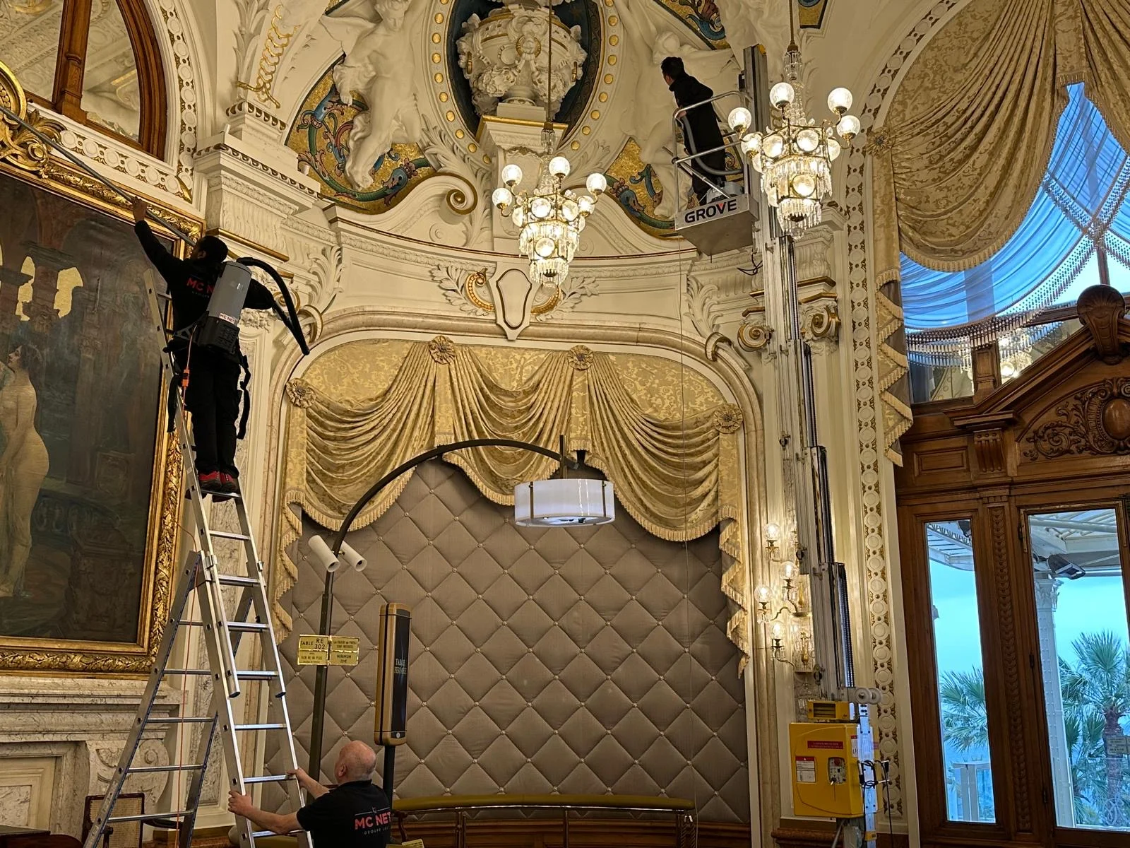 MC NET Cleaning team maintaining chandeliers in a Monaco palace